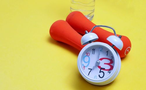 High angle view of clock on table