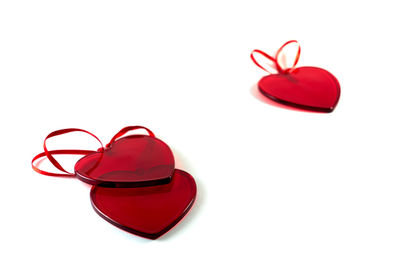 Close-up of red shoes over white background
