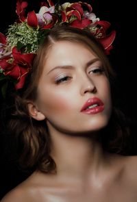 Close-up of young woman with bouquet