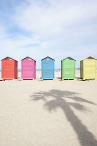 Beach huts against sky