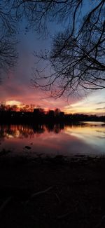 Scenic view of lake against romantic sky at sunset