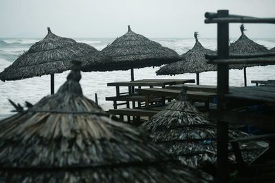 Gazebo by sea against sky