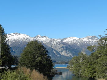 Scenic view of snowcapped mountains against clear sky