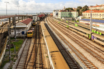 High angle view of railroad tracks in city against sky