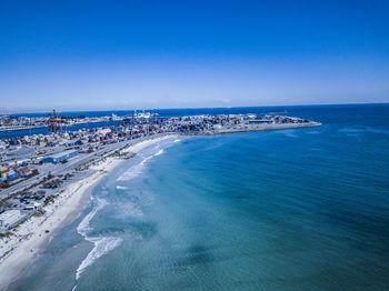 High angle view of sea against blue sky