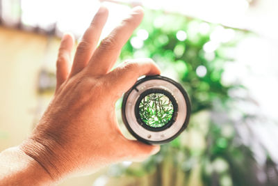 Close-up of man holding camera