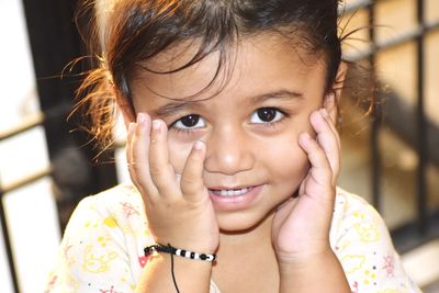 Close-up portrait of a smiling girl