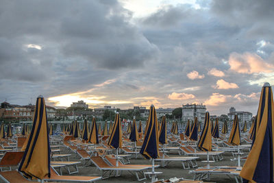 Panoramic view of buildings against cloudy sky