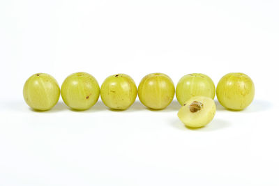 Close-up of fruits over white background