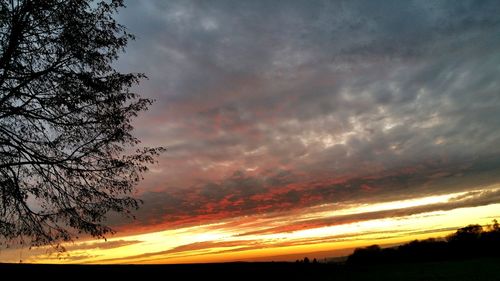 Scenic view of landscape against cloudy sky