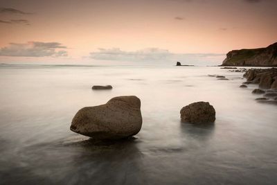 View of rocks in calm sea