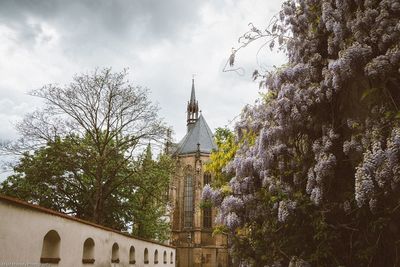 Low angle view of bell tower against sky