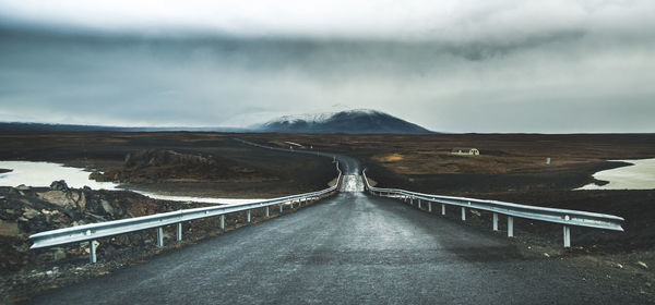 Road amidst landscape against sky