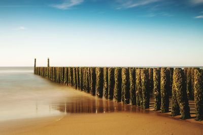 Scenic view of beach against clear sky