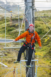 Man balancing on high rope obstacle course in iceland