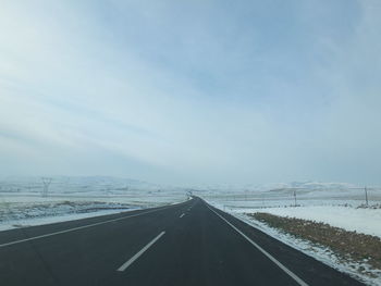 Road against sky during winter