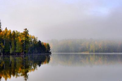 Scenic view of lake against sky during autumn