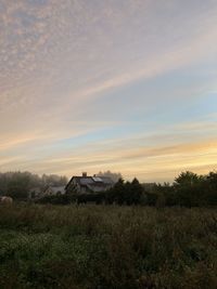 Scenic view of field against sky during sunset