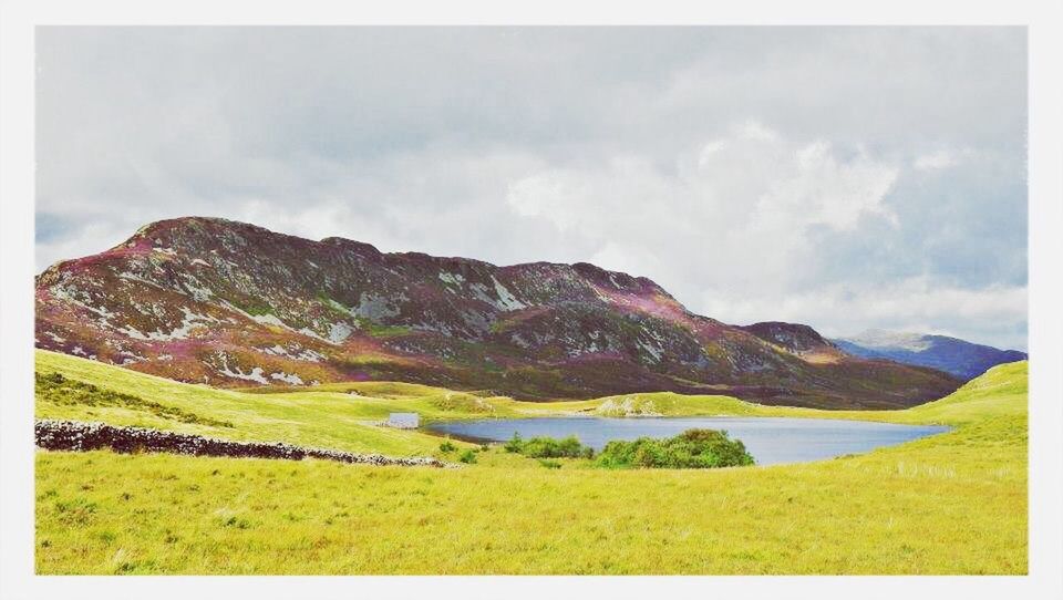 transfer print, mountain, tranquil scene, scenics, sky, tranquility, auto post production filter, beauty in nature, landscape, mountain range, cloud - sky, nature, water, lake, grass, cloud, idyllic, cloudy, non-urban scene, day