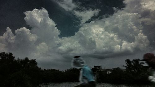 Silhouette of woman against sky