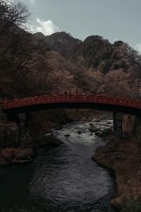 Bridge over river against sky
