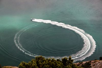 Aerial view of jet boat in sea