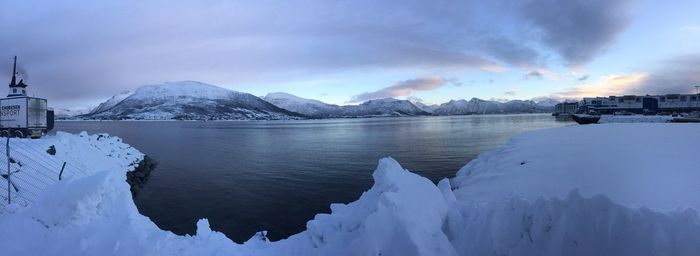 Scenic view of frozen lake against cloudy sky