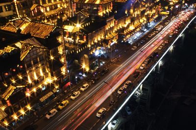 High angle view of light trails on road at night