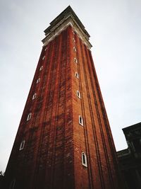 Low angle view of clock tower against sky