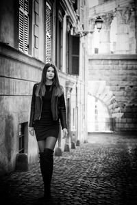 Full length of woman walking in corridor of building