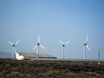 Wind turbines in field