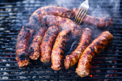 Close-up of meat on barbecue grill