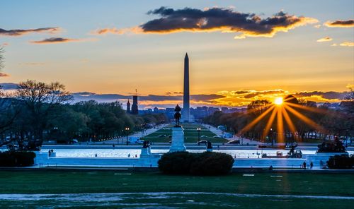 Scenic view of river against sky during sunset