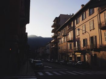 Vehicles on road along buildings