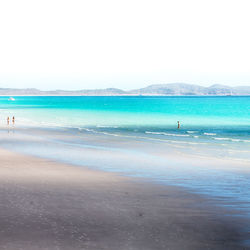 Scenic view of beach against clear sky