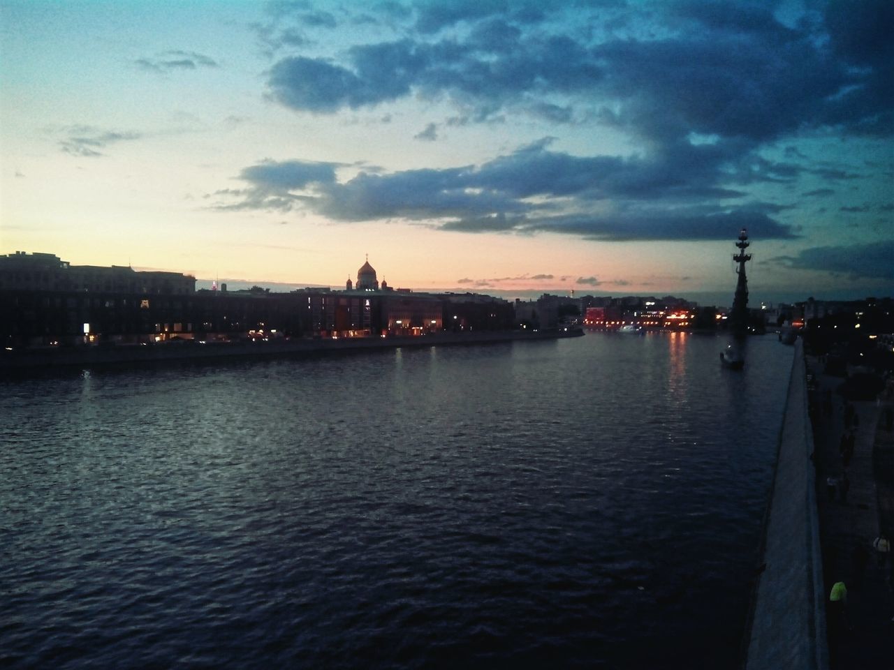 architecture, sky, building exterior, water, built structure, city, no people, sunset, river, outdoors, cloud - sky, silhouette, travel destinations, cityscape, skyscraper, harbor, nature, nautical vessel, illuminated, day, beauty in nature