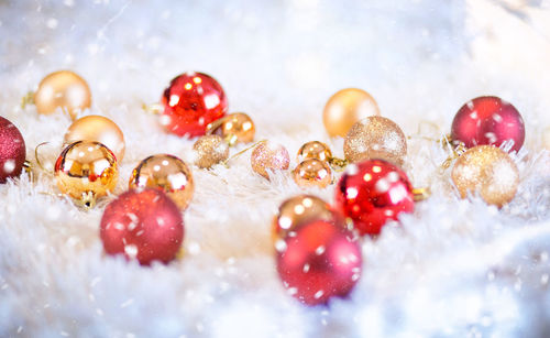 Close-up of christmas ornaments on fur
