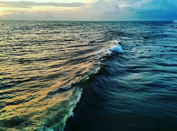 Scenic view of sea against blue sky