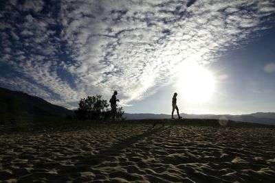 Silhouette of woman on landscape