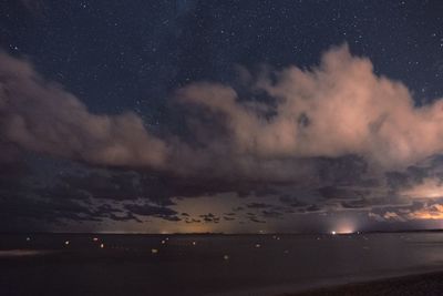 Scenic view of sea against sky at night