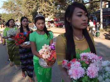 Portrait of a young woman with flowers