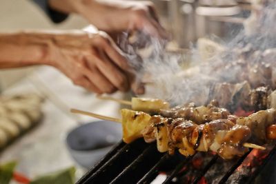 Close-up of meat on barbecue grill