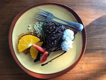 High angle view of fruits in plate on table