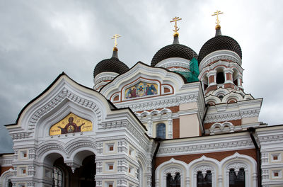 Low angle view of alexander nevsky cathedral against cloudy sky