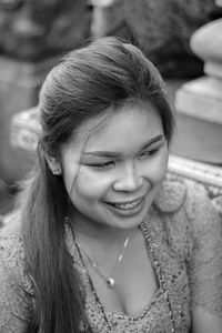 Close-up portrait of a smiling young woman