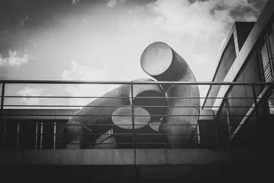 Low angle view of railing against sky