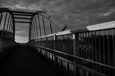 Bridge over footbridge against sky