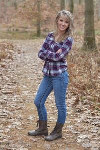 Portrait of young woman standing outdoors