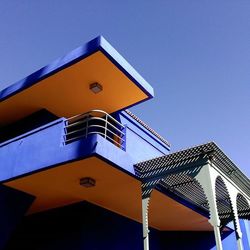 Low angle view of built structure against clear blue sky