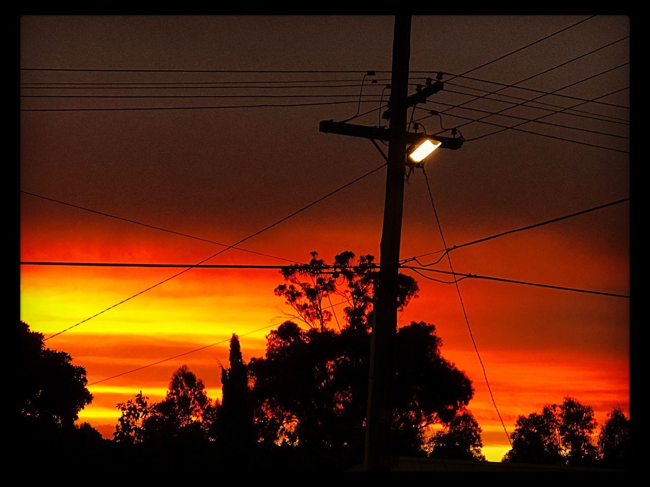 sunset, power line, cable, orange color, electricity, power supply, silhouette, fuel and power generation, sky, electricity pylon, no people, connection, nature, outdoors, romantic sky, beauty in nature, tree